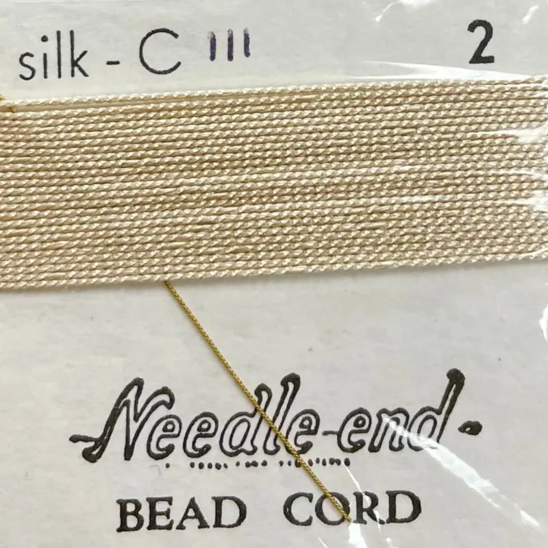 2 Packs #2 Cream Silk Bead Cord on card.