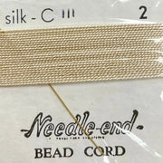 2 Packs #2 Cream Silk Bead Cord on card.