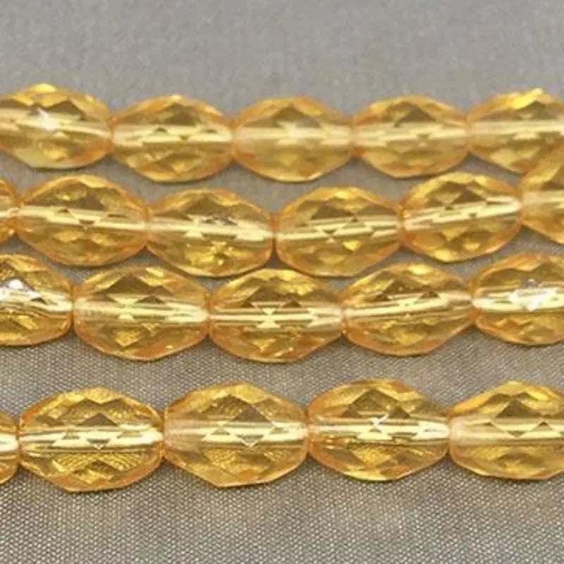 25 Golden Topaz Czech Faceted Oval Glass Beads - Sea Beads